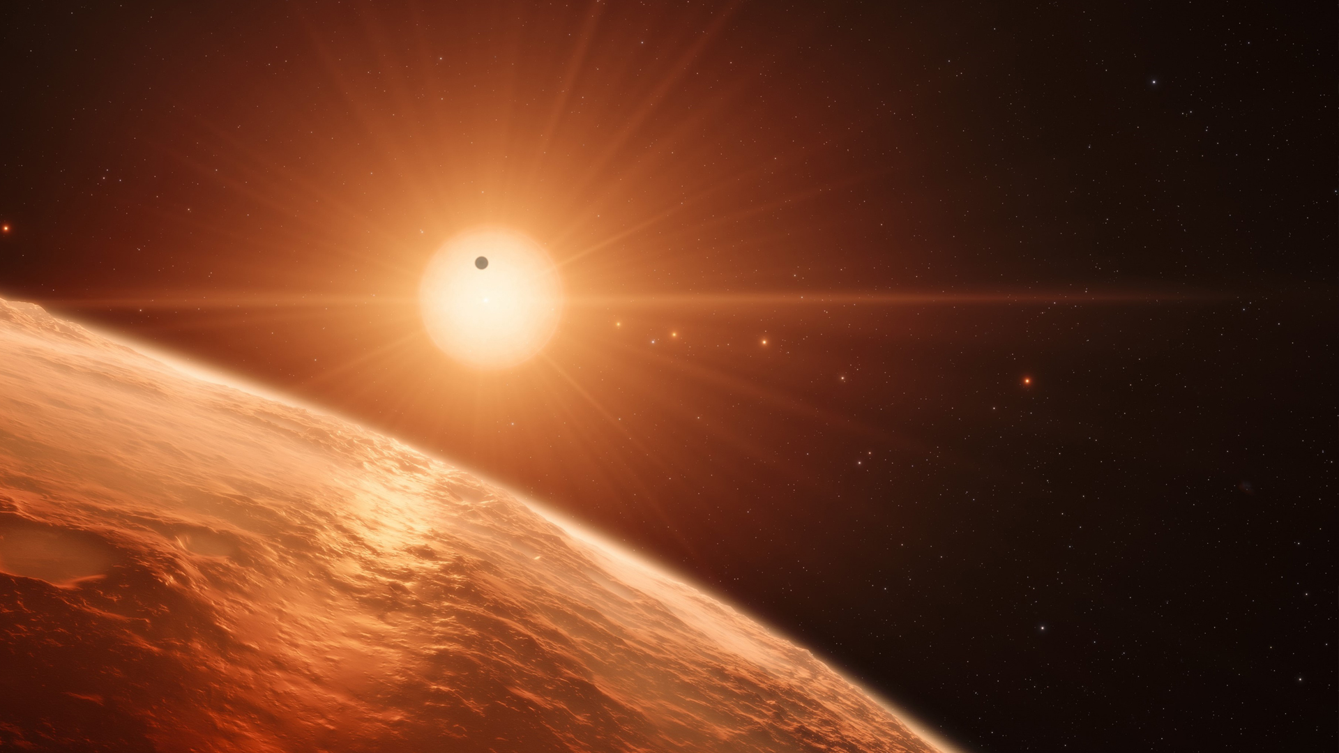 Recreación artística del sistema planetario TRAPPIST-1.ESO/N, una estrella de baja masa.