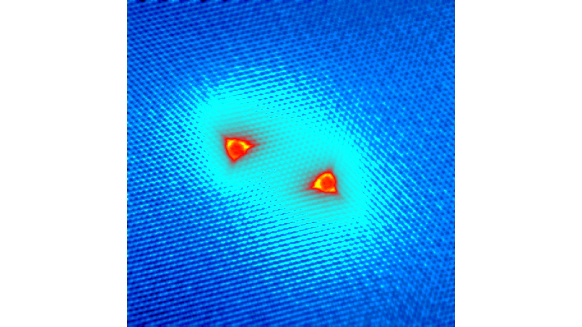 Mapa experimental del magnetismo creado por dos átomos de hidrógeno colocados sobre grafeno. La nube brillante muestra la interacción entre los dos espines-1/2 a distancias inusualmente largas / UAM